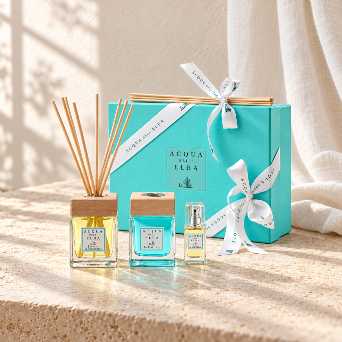 GIFT BOX - LIMONAIA DI SANT'ANDREA + ISOLA D'ELBA + ROOM SPRAY LIMONAIA DI SANT'ANDREA — complete gift set, natural window-light lifestyle